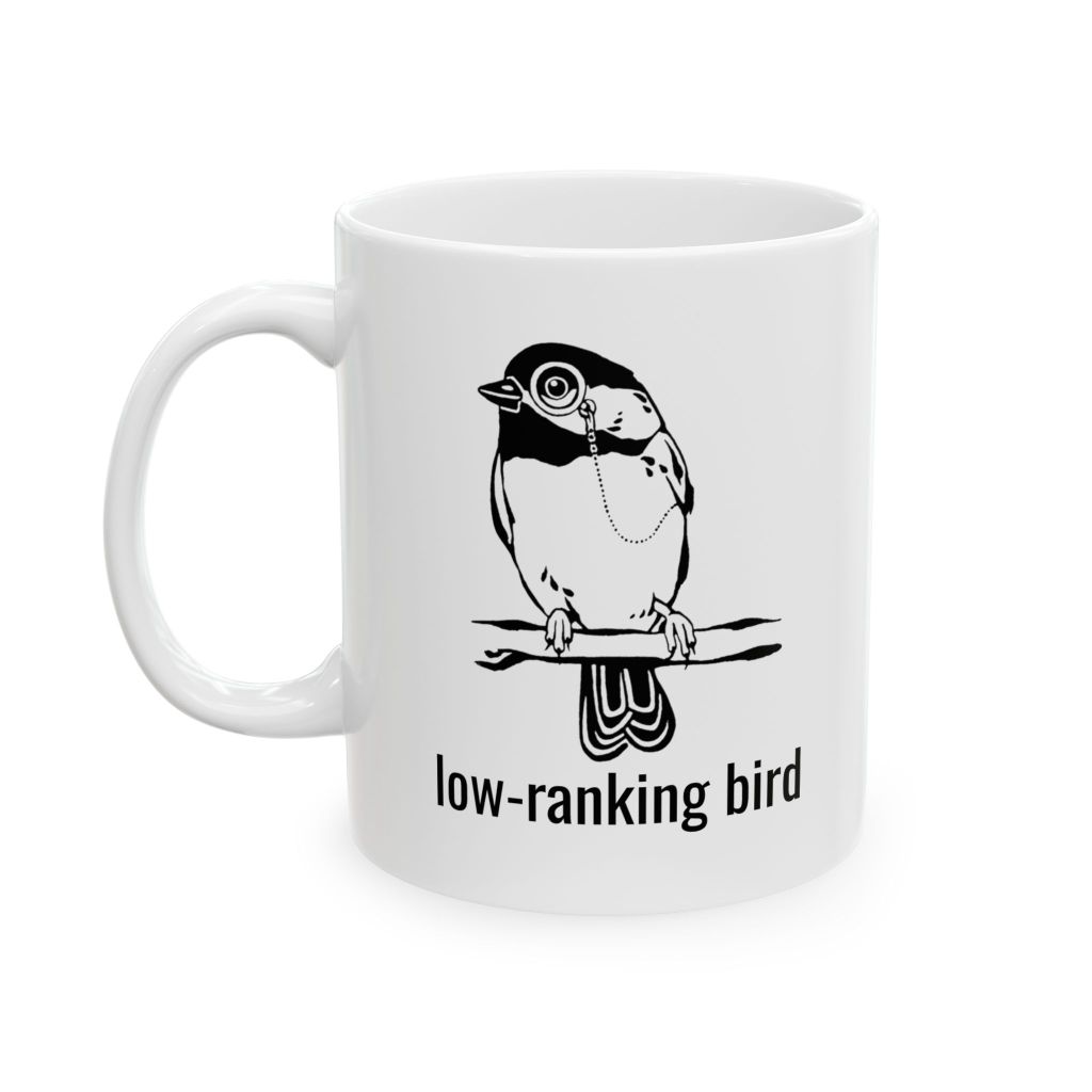 White coffee mug featuring a cartoon bird with glasses perched on a branch, labeled 'low-ranking bird'.